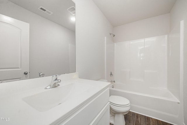 757 Frosty Way, Zebulon, NC 27597 - full bath featuring vanity, wood finished floors, and washtub / shower combination