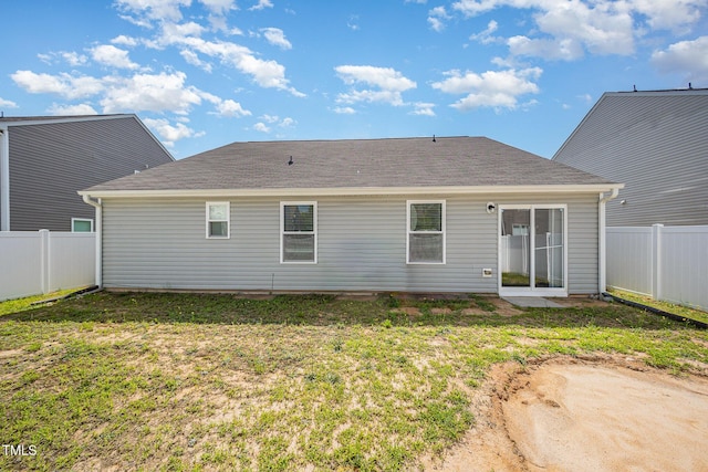 757 Frosty Way, Zebulon, NC 27597 - back of property featuring a fenced backyard and roof with shingles