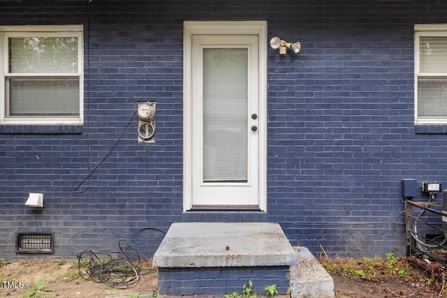 2752 Weldon Ter, Durham, NC 27703 - doorway to property featuring brick siding and crawl space