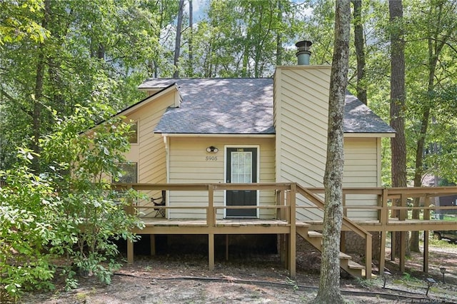 5905 Waters Edge Dr, Fayetteville, NC 28314 - back of property with a shingled roof and a wooden deck