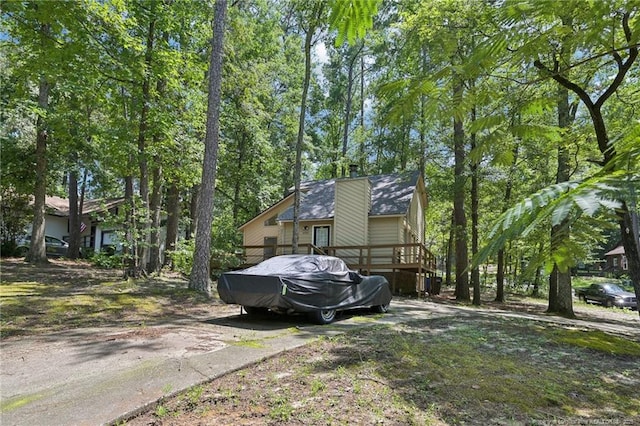 5905 Waters Edge Dr, Fayetteville, NC 28314 - view of side of property with a deck and a chimney