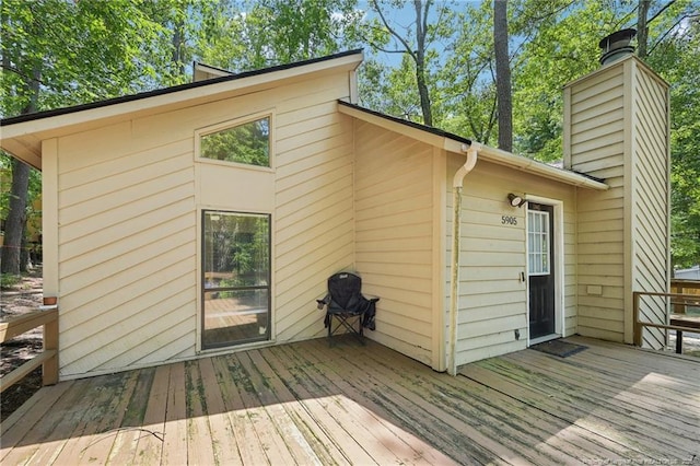 5905 Waters Edge Dr, Fayetteville, NC 28314 - back of house featuring a deck and a chimney