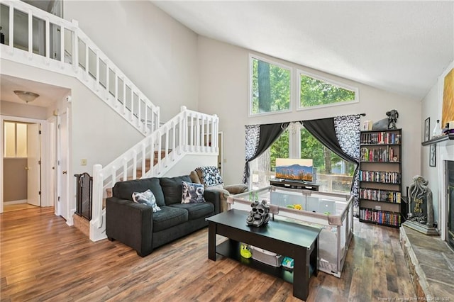 5905 Waters Edge Dr, Fayetteville, NC 28314 - living room with wood finished floors, lofted ceiling, and stairway