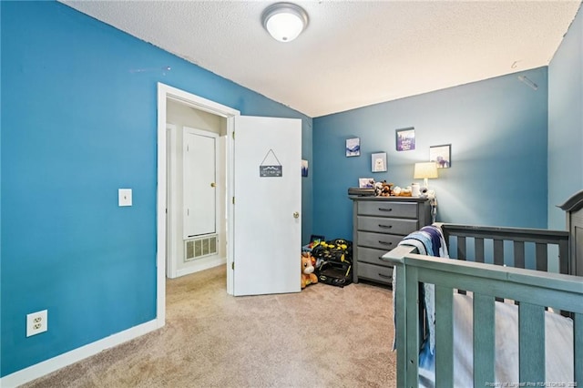 5905 Waters Edge Dr, Fayetteville, NC 28314 - bedroom featuring carpet floors, a textured ceiling, a crib, and vaulted ceiling