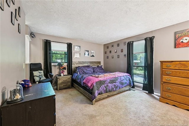 5905 Waters Edge Dr, Fayetteville, NC 28314 - bedroom featuring a textured ceiling and light carpet