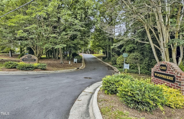 1311 Forest Hills Rd NW Unit E3, Wilson, NC 27896 - view of asphalt road featuring curbs