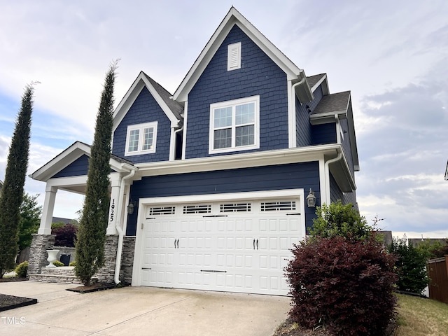 1925 Bright Kannon Way, Wendell, NC 27591 - view of front facade featuring concrete driveway, a garage, and stone siding