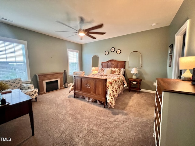 1925 Bright Kannon Way, Wendell, NC 27591 - carpeted bedroom featuring a ceiling fan and a fireplace