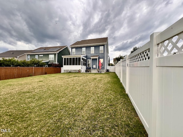 1925 Bright Kannon Way, Wendell, NC 27591 - back of house with a sunroom and a fenced backyard