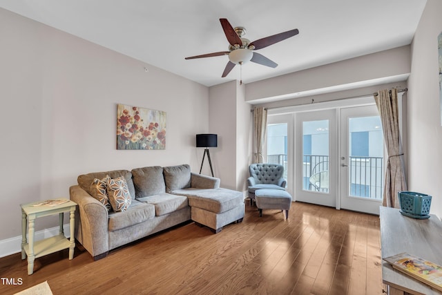 222 Glenwood Ave # 416, Raleigh, NC 27603 - living area featuring wood finished floors, a ceiling fan, and french doors