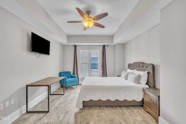222 Glenwood Ave # 416, Raleigh, NC 27603 - bedroom with a ceiling fan and a tray ceiling
