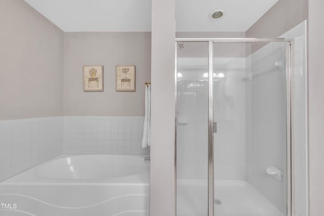 222 Glenwood Ave # 416, Raleigh, NC 27603 - bathroom featuring a shower stall and a garden tub