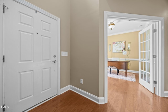 2505 Goldeneye Ct, Raleigh, NC 27606 - entryway with wood finished floors and crown molding