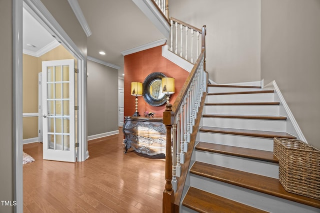 2505 Goldeneye Ct, Raleigh, NC 27606 - stairway with ornamental molding, wood finished floors, and recessed lighting