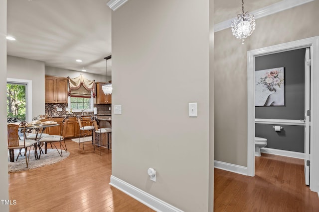 2505 Goldeneye Ct, Raleigh, NC 27606 - hallway featuring light wood-style flooring, recessed lighting, and a chandelier