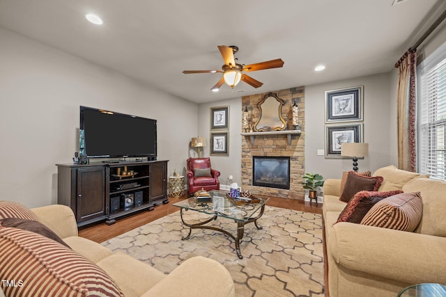 2505 Goldeneye Ct, Raleigh, NC 27606 - living room with wood finished floors, recessed lighting, a ceiling fan, and a fireplace
