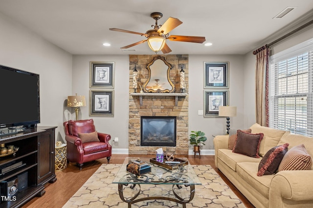 2505 Goldeneye Ct, Raleigh, NC 27606 - living room with a ceiling fan, wood finished floors, recessed lighting, and a fireplace