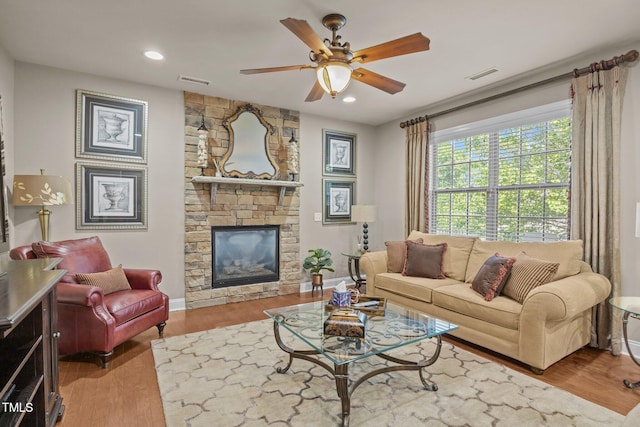 2505 Goldeneye Ct, Raleigh, NC 27606 - living room featuring a ceiling fan, wood finished floors, recessed lighting, and a fireplace