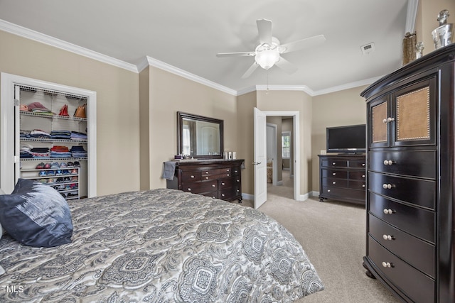 2505 Goldeneye Ct, Raleigh, NC 27606 - bedroom featuring carpet, ornamental molding, ceiling fan, and a spacious closet