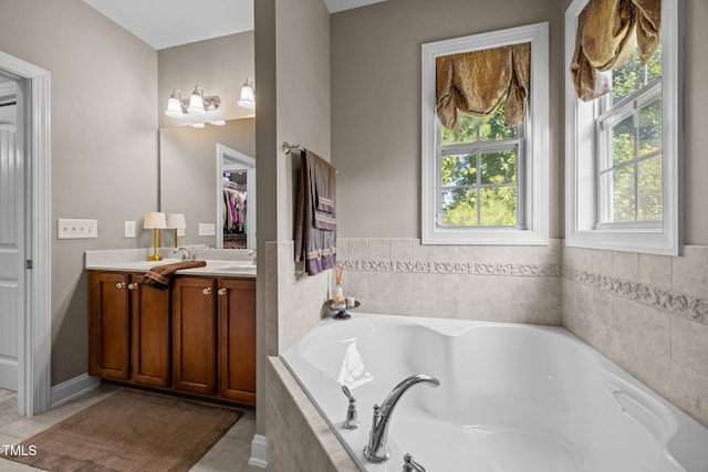 2505 Goldeneye Ct, Raleigh, NC 27606 - bathroom with vanity, tile patterned floors, and a bath