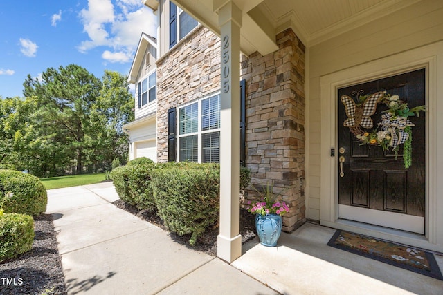 2505 Goldeneye Ct, Raleigh, NC 27606 - view of exterior entry with stone siding and a garage