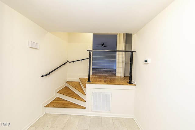 2309 Bertie Dr, Raleigh, NC 27610 - stairs with baseboards and a ceiling fan