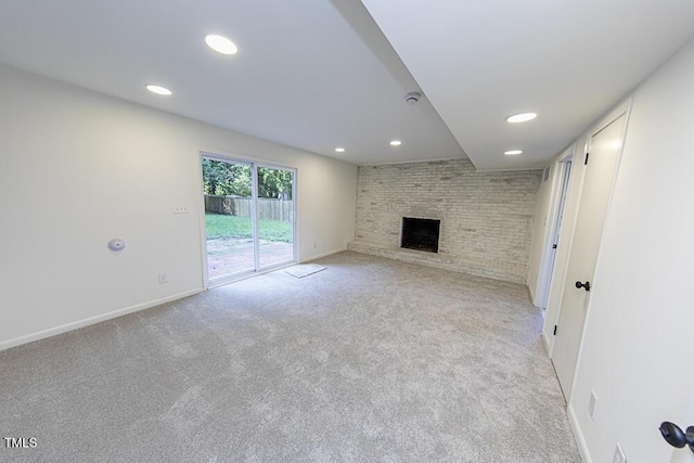 2309 Bertie Dr, Raleigh, NC 27610 - unfurnished living room with recessed lighting, a fireplace, and light carpet