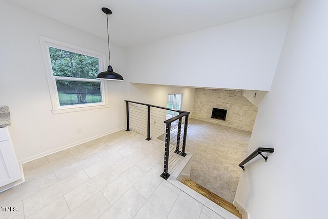 2309 Bertie Dr, Raleigh, NC 27610 - stairs with tile patterned flooring and a fireplace