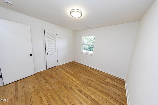 2309 Bertie Dr, Raleigh, NC 27610 - unfurnished bedroom featuring light wood-style flooring and a closet