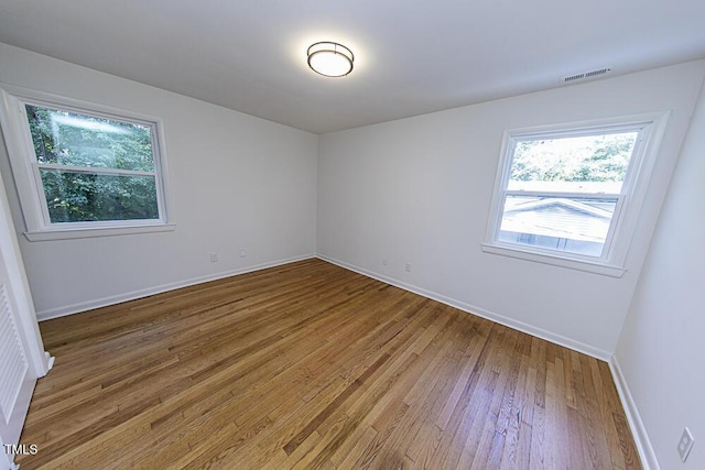 2309 Bertie Dr, Raleigh, NC 27610 - spare room with wood finished floors and baseboards