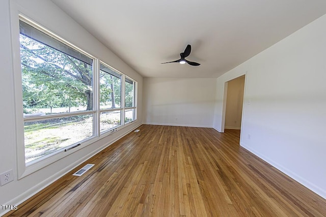 2309 Bertie Dr, Raleigh, NC 27610 - empty room with hardwood / wood-style floors and a ceiling fan