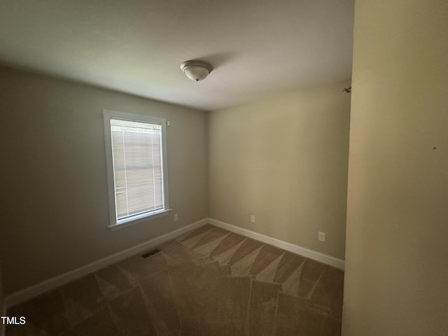 12719 S St, Whitakers, NC 27891 - unfurnished room with carpet floors and baseboards