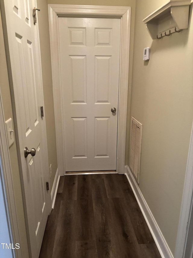 12719 S St, Whitakers, NC 27891 - doorway to outside with dark wood-style floors and baseboards