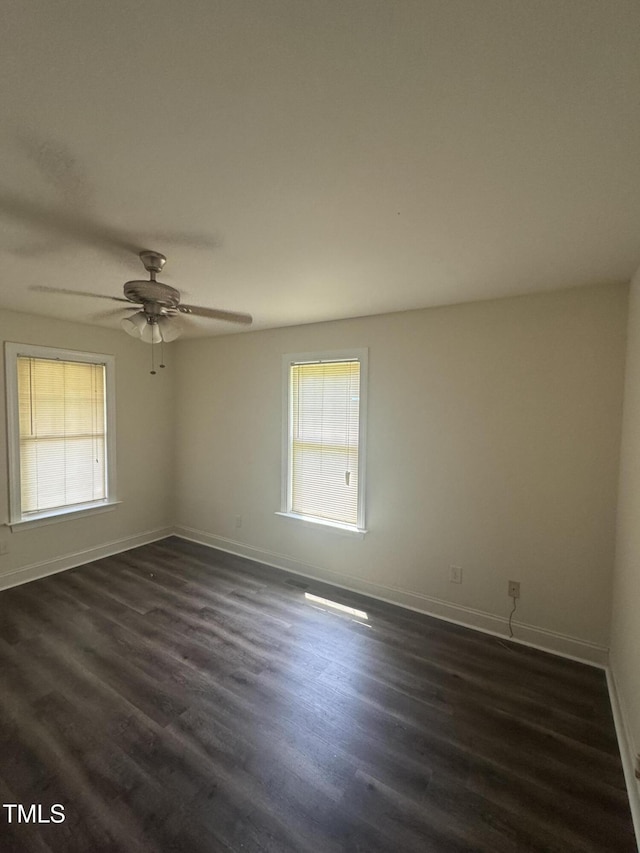 12719 S St, Whitakers, NC 27891 - empty room featuring plenty of natural light, dark wood-type flooring, and ceiling fan