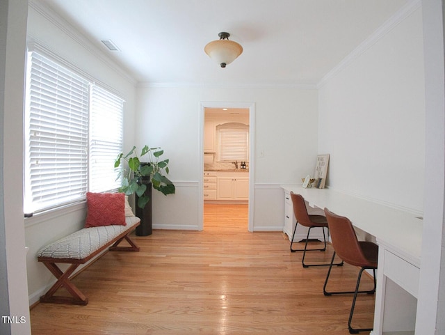 503 N Glen Dr, Raleigh, NC 27609 - office area with crown molding, healthy amount of natural light, and light wood-style flooring