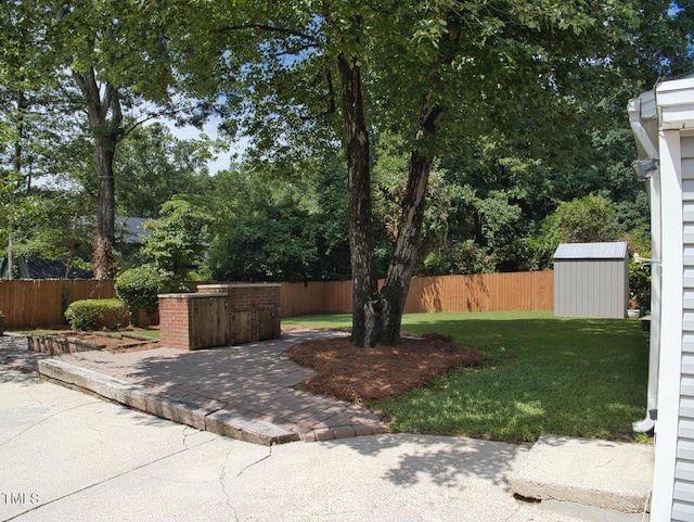 503 N Glen Dr, Raleigh, NC 27609 - fenced yard featuring a shed and a patio area