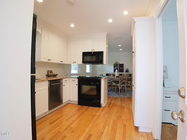 503 N Glen Dr, Raleigh, NC 27609 - kitchen featuring black appliances, white cabinets, light wood finished floors, backsplash, and light stone countertops