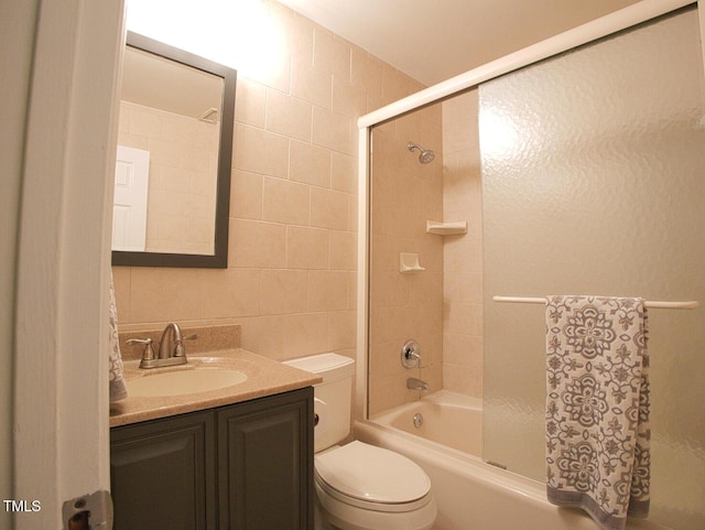 503 N Glen Dr, Raleigh, NC 27609 - bathroom featuring tile walls, vanity, and shower / washtub combination