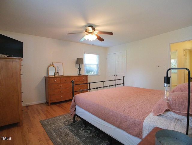 503 N Glen Dr, Raleigh, NC 27609 - bedroom with light wood-style flooring, a closet, and a ceiling fan