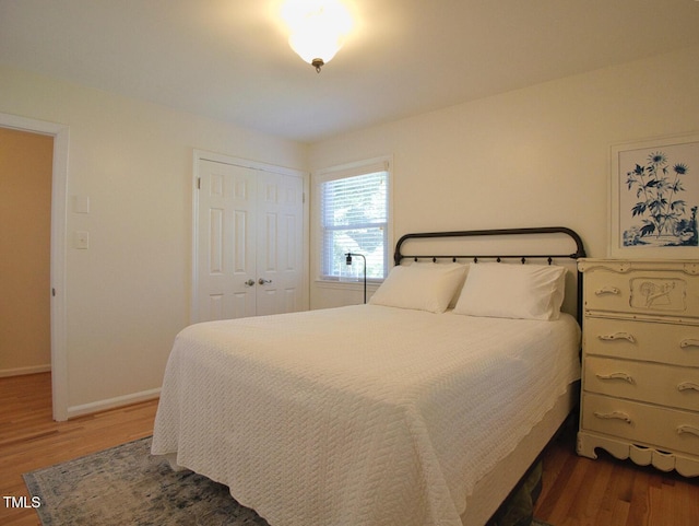 503 N Glen Dr, Raleigh, NC 27609 - bedroom with dark wood-style flooring and a closet