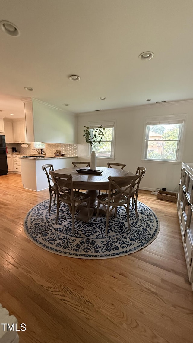 503 N Glen Dr, Raleigh, NC 27609 - dining space featuring light wood-style floors and recessed lighting