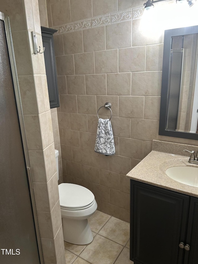 503 N Glen Dr, Raleigh, NC 27609 - bathroom featuring vanity, tile patterned flooring, and tile walls