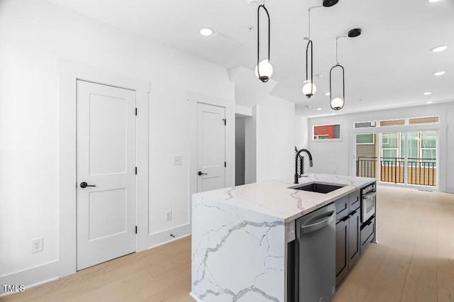 2 Seawell Ave Unit 101, Raleigh, NC 27601 - kitchen featuring light wood-style floors, decorative light fixtures, dishwasher, recessed lighting, and an island with sink