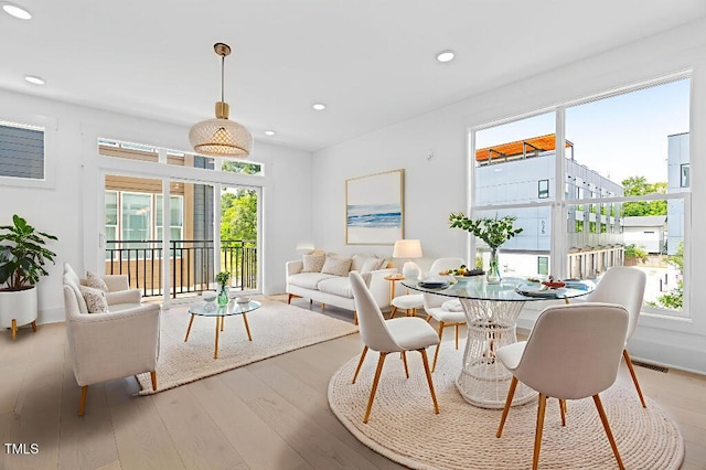 2 Seawell Ave Unit 101, Raleigh, NC 27601 - dining area with healthy amount of natural light, wood finished floors, and recessed lighting