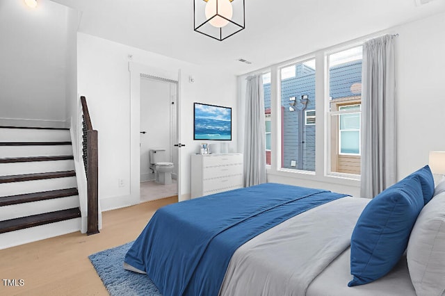 2 Seawell Ave Unit 101, Raleigh, NC 27601 - bedroom featuring ensuite bath and wood finished floors
