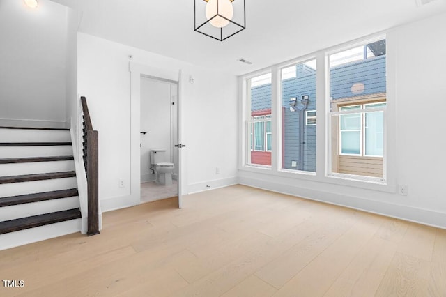 2 Seawell Ave Unit 101, Raleigh, NC 27601 - unfurnished room featuring wood finished floors and stairway