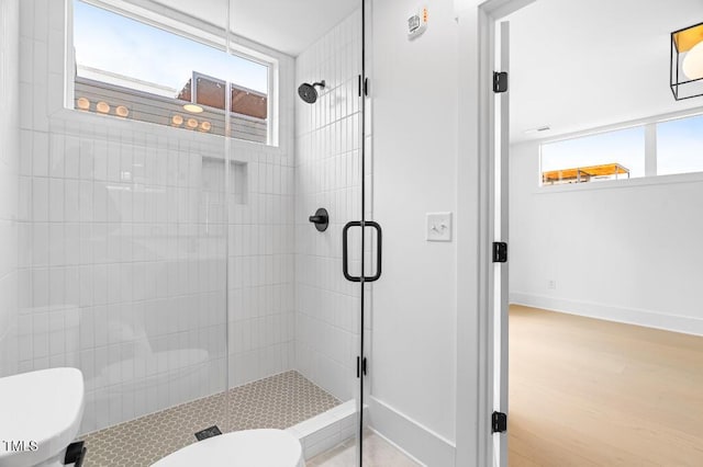 2 Seawell Ave Unit 101, Raleigh, NC 27601 - full bathroom with a stall shower and wood finished floors
