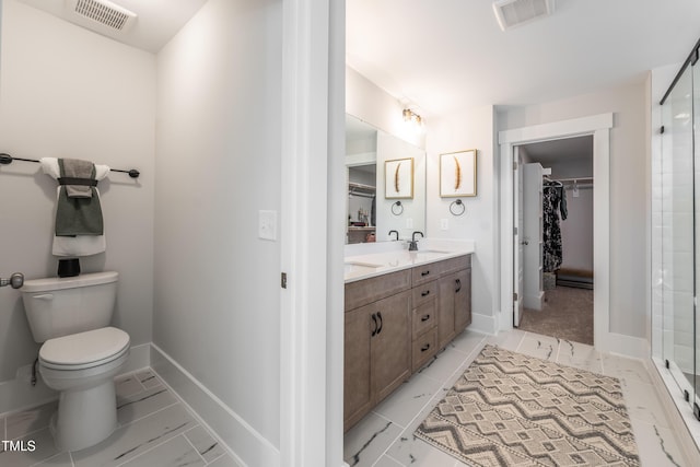 249 Dona Dr, Carthage, NC 28327 - full bathroom with double vanity, a walk in closet, a shower with shower door, and marble look tile flooring