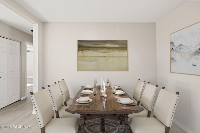 dining space featuring light hardwood / wood-style floors