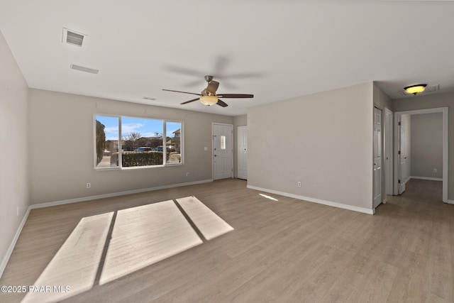 spare room featuring ceiling fan and light hardwood / wood-style flooring